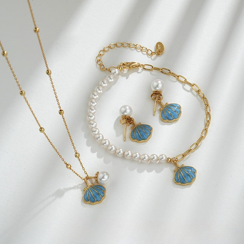 Parure or collier bracelet perles et boucles coquillage bleu